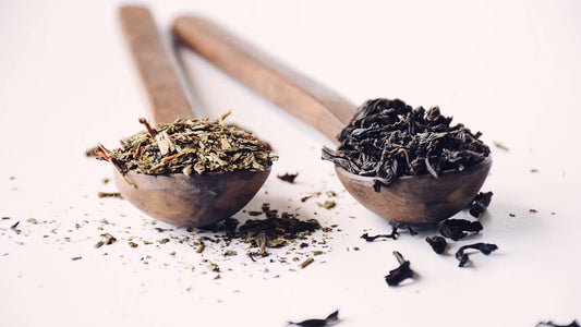 Loose leaf tea in wooden spoons on white background, perfect for Mora home décor and kitchen.