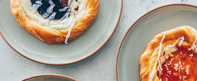 Rimmed & Speckled by Mora—hand-glazed ceramic dinnerware with soft speckles and a gently rimmed finish, made for calm meals and easy hosting.